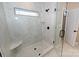 Walk-in glass shower features bench, shower niche, and window providing natural light at 4940 Southview Dr, Hickory, NC 28602