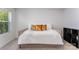 Bright bedroom with a comfortable daybed, gold accent pillows, and a small storage shelf at 5010 Arbordale Way, Mount Holly, NC 28120