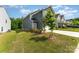 Charming home with a well-kept lawn, mature tree and a paved driveway at 5010 Arbordale Way, Mount Holly, NC 28120