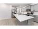 Well-lit kitchen with an island, stainless steel appliances, and light gray cabinets at 5010 Arbordale Way, Mount Holly, NC 28120