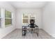 Home office with bright light, neutral paint and luxury vinyl plank flooring at 5010 Arbordale Way, Mount Holly, NC 28120