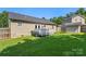 A spacious backyard with a wooden deck, a storage shed, and a well-maintained lawn at 5206 Crane Point Dr, Charlotte, NC 28227