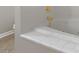 Bathroom featuring a large bathtub with gold fixtures at 5206 Crane Point Dr, Charlotte, NC 28227