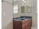 Bathroom featuring a double sink vanity and a large mirror at 5206 Crane Point Dr, Charlotte, NC 28227