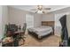 Bedroom with a bed, desk and ceiling fan at 5206 Crane Point Dr, Charlotte, NC 28227