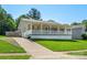 Charming single-story home with a spacious front porch and well-manicured lawn at 5206 Crane Point Dr, Charlotte, NC 28227