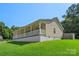 Cozy home featuring a covered porch, complemented by a well-maintained lawn at 5206 Crane Point Dr, Charlotte, NC 28227