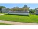 A quaint home with a welcoming front porch and lush green lawn at 5206 Crane Point Dr, Charlotte, NC 28227