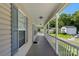 Inviting front porch with classic white railings and ample space for relaxation at 5206 Crane Point Dr, Charlotte, NC 28227