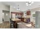 Charming kitchen featuring stainless steel appliances, granite counters, and ample storage space at 5206 Crane Point Dr, Charlotte, NC 28227