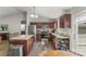 Well-equipped kitchen with stainless steel appliances, granite counters, and eat-in dining area at 5206 Crane Point Dr, Charlotte, NC 28227