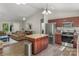 Open kitchen featuring stainless steel appliances, granite counters, and an island with bar seating at 5206 Crane Point Dr, Charlotte, NC 28227