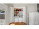 Convenient laundry area with full-size washer and dryer, ample shelving for supplies at 5206 Crane Point Dr, Charlotte, NC 28227