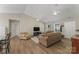 Bright living room with hardwood floors, vaulted ceilings and comfortable seating at 5206 Crane Point Dr, Charlotte, NC 28227