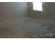 Bright bedroom features carpetless floor and window overlooking the property at 569 River View Dr, Lowell, NC 28098