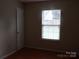Cozy bedroom featuring natural light from the window and ample closet space at 569 River View Dr, Lowell, NC 28098
