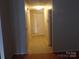 Interior view of hallway featuring a front door with window and overhead lighting at 569 River View Dr, Lowell, NC 28098