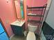 Bathroom features modern sink and toilet and shelving for storage at 589 Owls Den Rd, Lincolnton, NC 28092