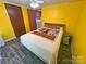 Bedroom features wood-look floors, ceiling fan and a closet for storage at 589 Owls Den Rd, Lincolnton, NC 28092
