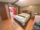 Cozy bedroom with laminate flooring and great natural light, features ensuite bath at 589 Owls Den Rd, Lincolnton, NC 28092