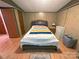 Comfortable bedroom with wood accents, neutral decor, and ample natural light at 589 Owls Den Rd, Lincolnton, NC 28092