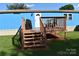 Inviting front entrance with a charming porch and covered grill area at 589 Owls Den Rd, Lincolnton, NC 28092