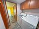 Laundry Room boasts modern washer and dryer set, and handy storage at 589 Owls Den Rd, Lincolnton, NC 28092