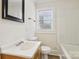 Bathroom featuring tub, and updated fixtures and natural light at 603 Paradise St, Monroe, NC 28112