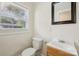 Bathroom view highlighting sink, toilet, and a window for light at 603 Paradise St, Monroe, NC 28112