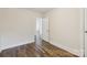 Bright bedroom with hardwood flooring, neutral walls, and white trim at 603 Paradise St, Monroe, NC 28112