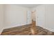Bedroom featuring neutral walls, hardwood flooring, and a double door at 603 Paradise St, Monroe, NC 28112