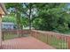 Spacious stained-wood deck offering an excellent view of the backyard and neighborhood at 603 Paradise St, Monroe, NC 28112