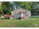 Charming home with a well-maintained front yard, a front porch, and a side deck at 603 Paradise St, Monroe, NC 28112