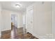 Hallway featuring hardwood floors and access to other rooms at 603 Paradise St, Monroe, NC 28112