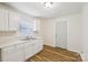 Clean, white kitchen featuring ample counter space and modern fixtures at 603 Paradise St, Monroe, NC 28112