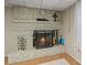 Basement living area features a brick fireplace with mantle at 6632 Candlewood Dr, Charlotte, NC 28210
