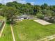 Aerial shot showcases pool, volleyball court, and green spaces within a community setting at 6632 Candlewood Dr, Charlotte, NC 28210