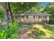 Lovely brick home with charming details, including decorative window accents and a cozy front entrance at 6632 Candlewood Dr, Charlotte, NC 28210