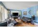 Spacious living room with ample seating, natural light, and a cozy ambiance for relaxation at 6632 Candlewood Dr, Charlotte, NC 28210