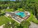 Aerial view of a community pool featuring spacious sundeck and mature trees at 6632 Candlewood Dr, Charlotte, NC 28210