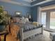 Serene main bedroom featuring bright blue walls and French doors at 860 Wynnshire Dr, Hickory, NC 28601