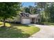 Single-story home showcasing a well-kept lawn and stone accents at 860 Wynnshire Dr, Hickory, NC 28601