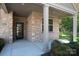 Close-up of the welcoming front porch with a stone facade and a view of the front door at 860 Wynnshire Dr, Hickory, NC 28601