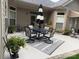 Covered patio showcases dining set, outdoor furniture, and lush landscaping at 860 Wynnshire Dr, Hickory, NC 28601