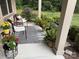 Charming front porch with chairs, plants, and neutral rug at 860 Wynnshire Dr, Hickory, NC 28601