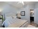 Cozy bedroom with a comfortable bed, neutral decor, and access to an ensuite bathroom at 8637 Annabel Lee Ln, Charlotte, NC 28277