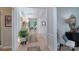 Inviting hallway with stylish decor, light wood floors, and views into the living spaces at 8637 Annabel Lee Ln, Charlotte, NC 28277