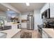 Bright kitchen features stainless steel appliances, white cabinets, and hardwood floors at 8637 Annabel Lee Ln, Charlotte, NC 28277