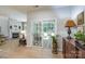 Bright living room area with fireplace and french doors leading to the outdoor patio at 8637 Annabel Lee Ln, Charlotte, NC 28277