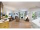 Bright and airy living room with fireplace, large windows, and hardwood floors at 8637 Annabel Lee Ln, Charlotte, NC 28277